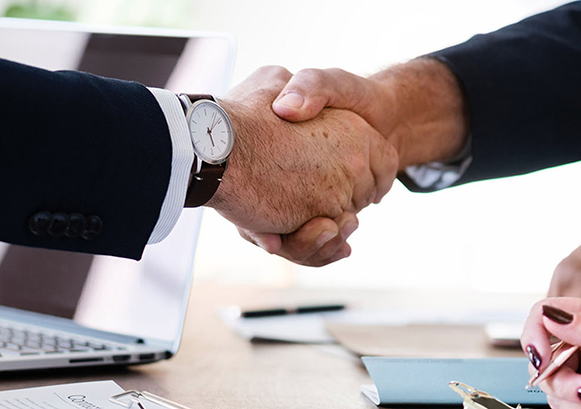 Two people checking hands