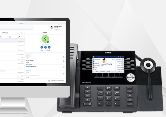 A Mitel phone and a computer side by side