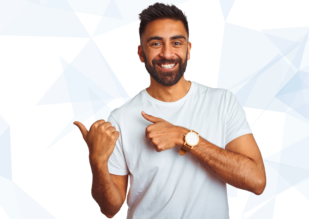 A guy smiling on pointing fingers to his right