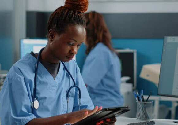 Nurse looking at a tablet