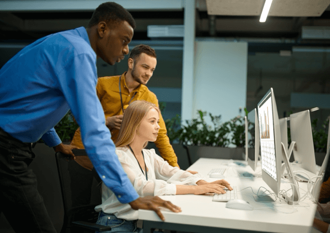 People working and looking at a screen