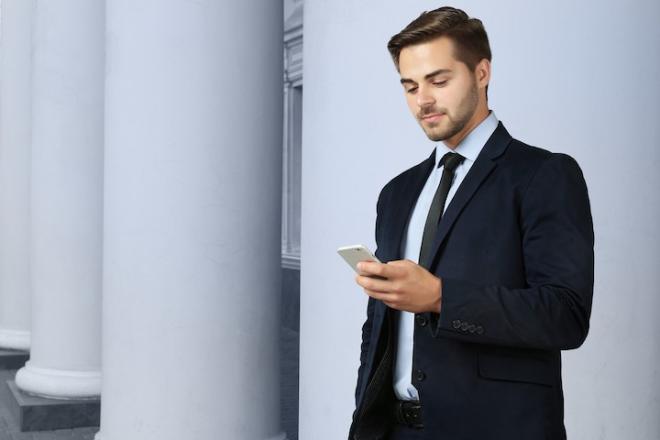 A guy looking at his phone