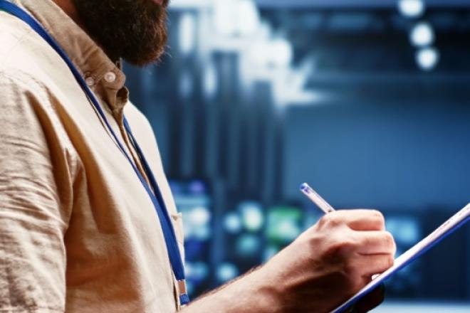 man writing on a tablet