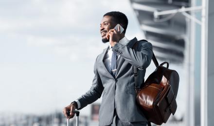 Man with a suit on the phone