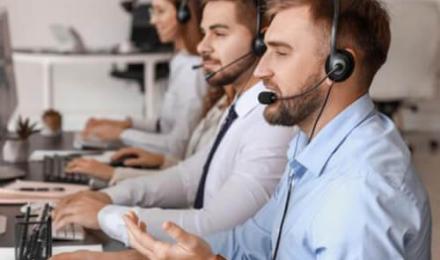 Man on desktop with headset