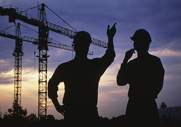 Two field workers outside
