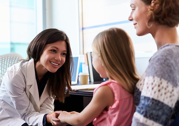 Doctor looking her patient and her kid