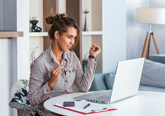 A woman looking at her computer