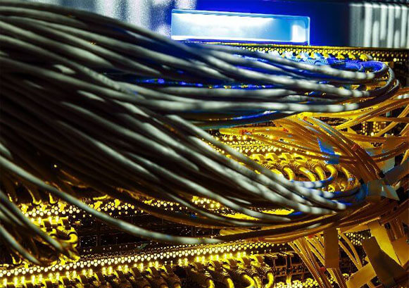 A bunch of cables in a server room