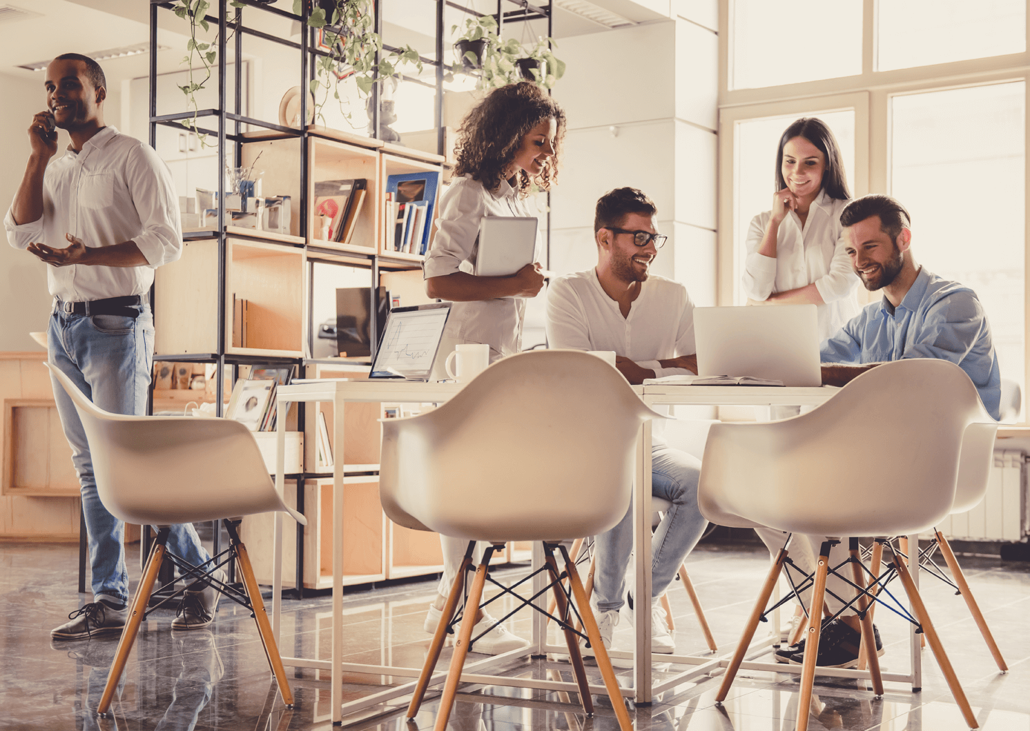 Multiple people collaborating in an office space