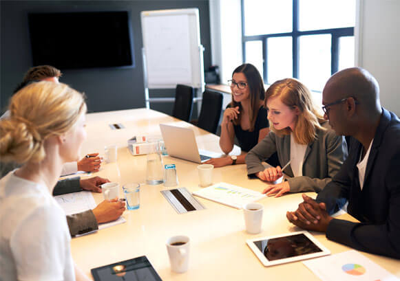 Group of people talking at work