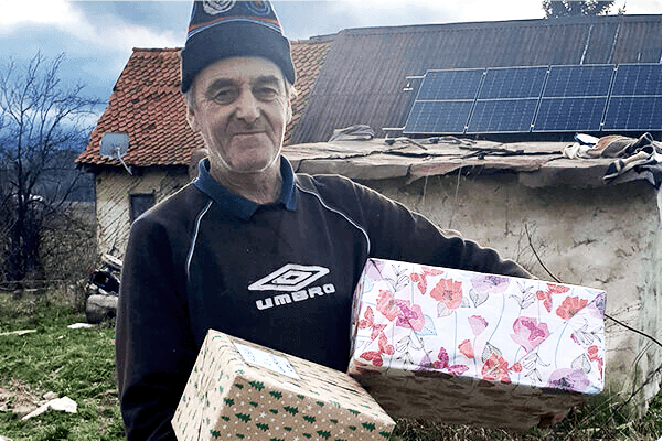 MitelServes-man with presents