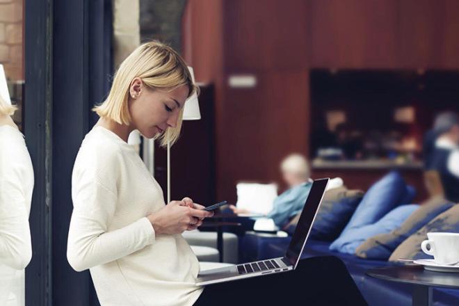 A woman looking at her phone