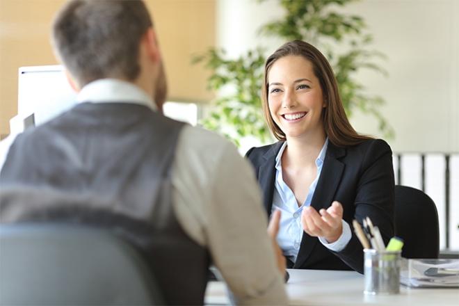 A woman talking to a man