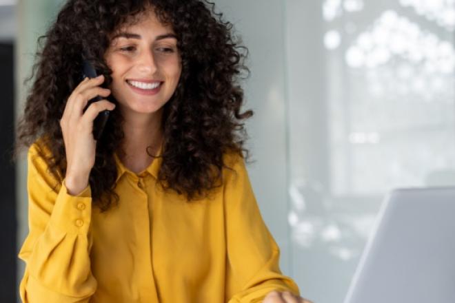 Woman on the phone smiling