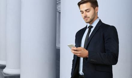 A guy looking at his phone