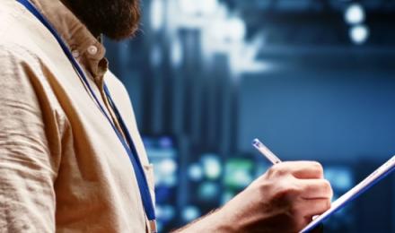 Man writting on a tablet