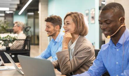 People part of a contact center in an office working
