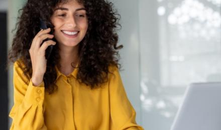 Woman on the phone smiling