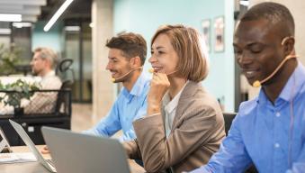 People part of a contact center in an office working