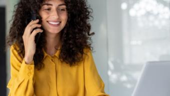 Woman on the phone smiling