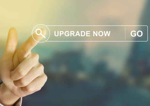 A visual of a finger clicking on an Upgrade Now button