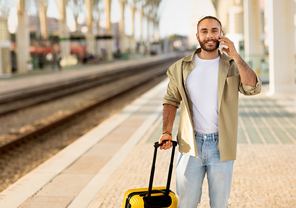 Man on the train station on the phone