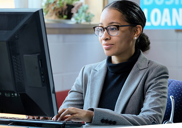 A woman working in front of her computer