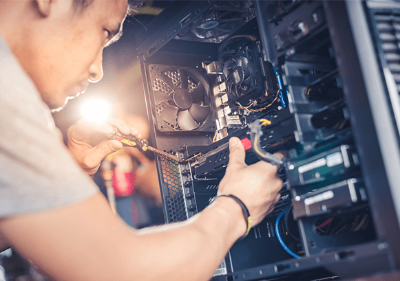 A guy repairing a computer