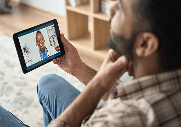 A guy on a video call with his doctor