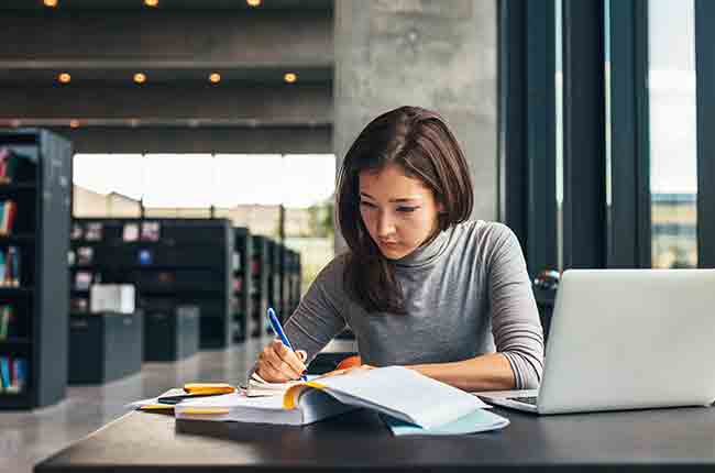 A woman working on a library