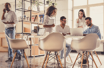 Multiple people collaborating in an office space