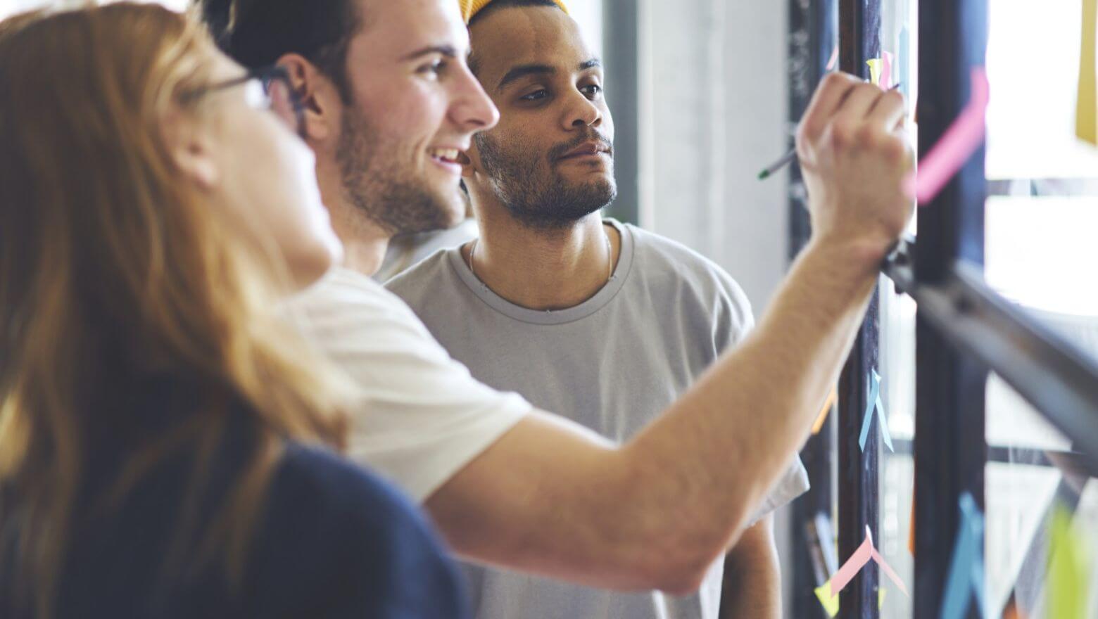 Three people collaborating