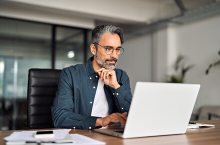 A guy in front of his laptop