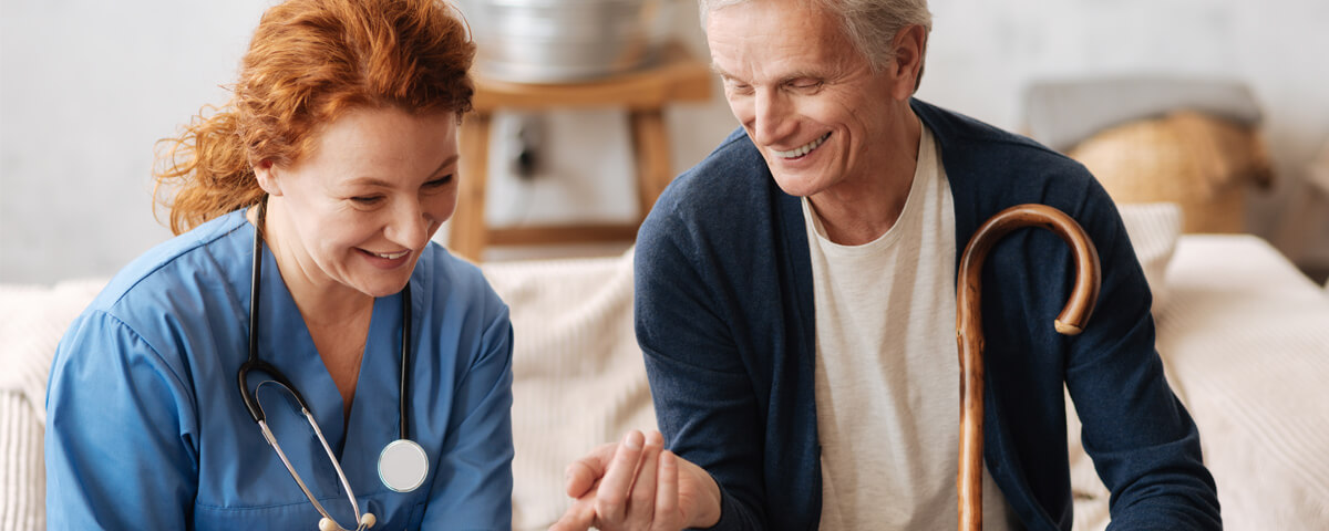 A medical person and a man talking together