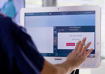 Hand touching computer screen HiMed