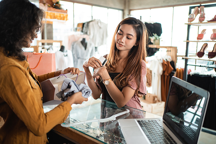 Woman shopping at boutique store