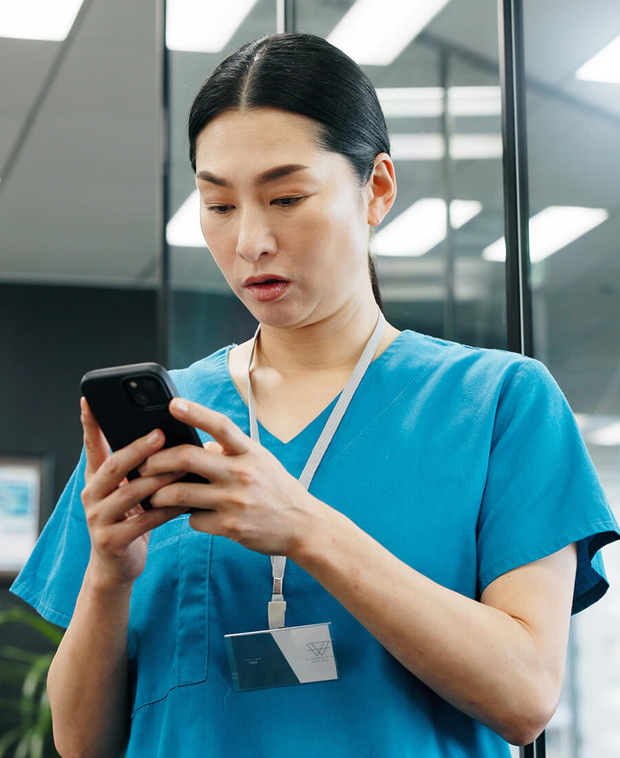 clinician looking at handheld device