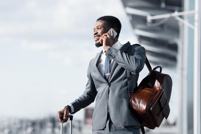 Man with a suit on the phone