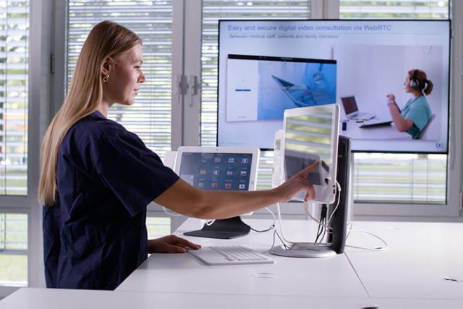 Woman touching computer screen HiMed