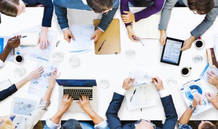 People that are collaborating around a table