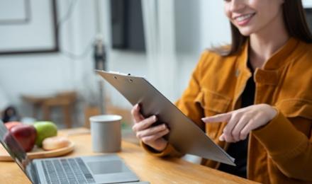 A woman looking at her tablet