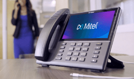Mitel 6900 with Mitel logo on screen