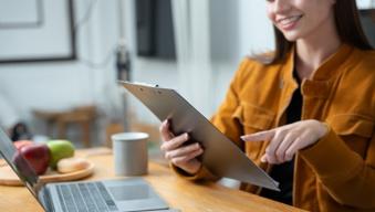 A woman looking at her tablet